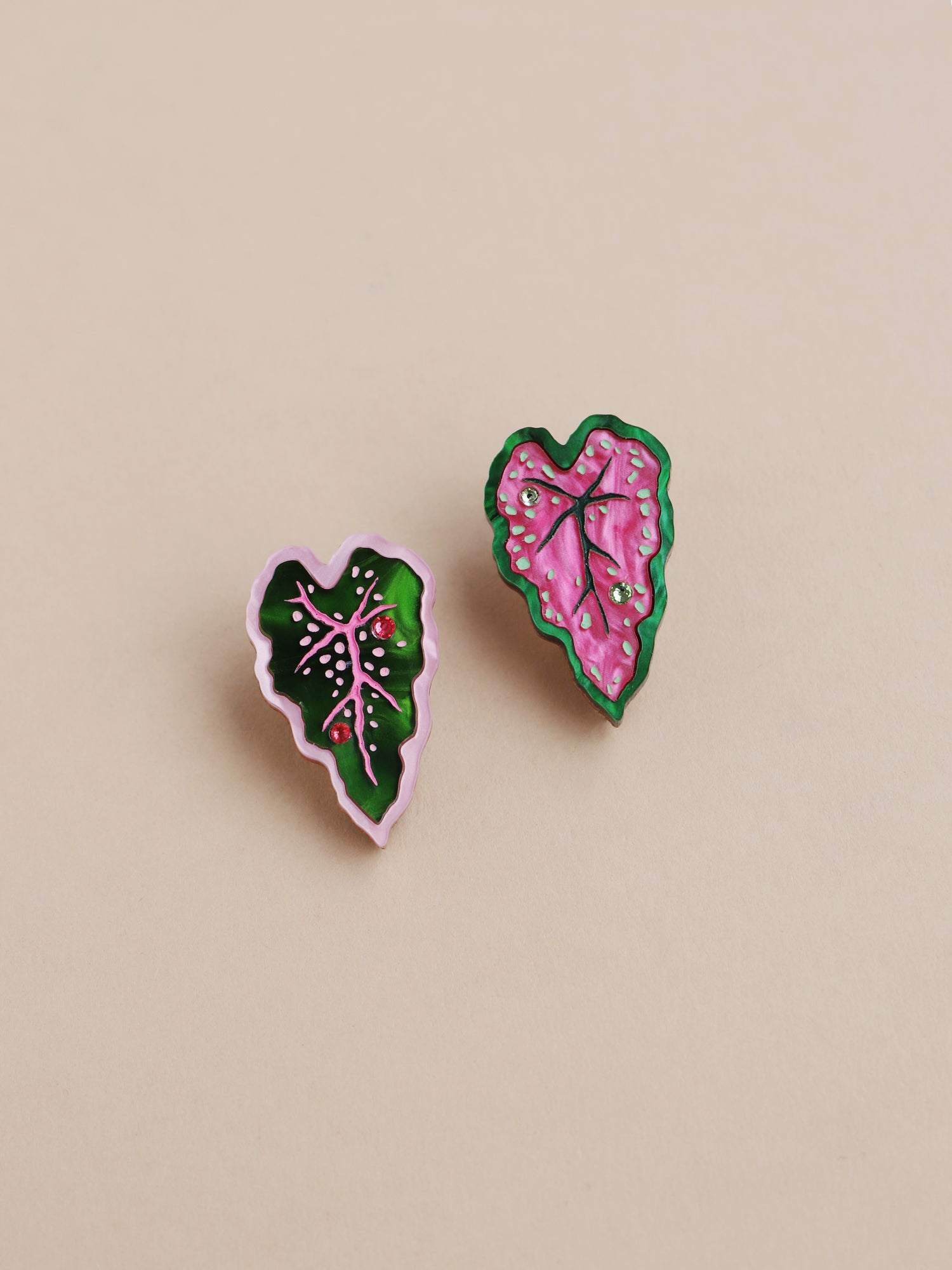 Heart-shaped caladium leaf clip-on earrings. A design collaboration with L.O.M, a colourful party-wear brand. Handmade in the UK by Wolf & Moon.