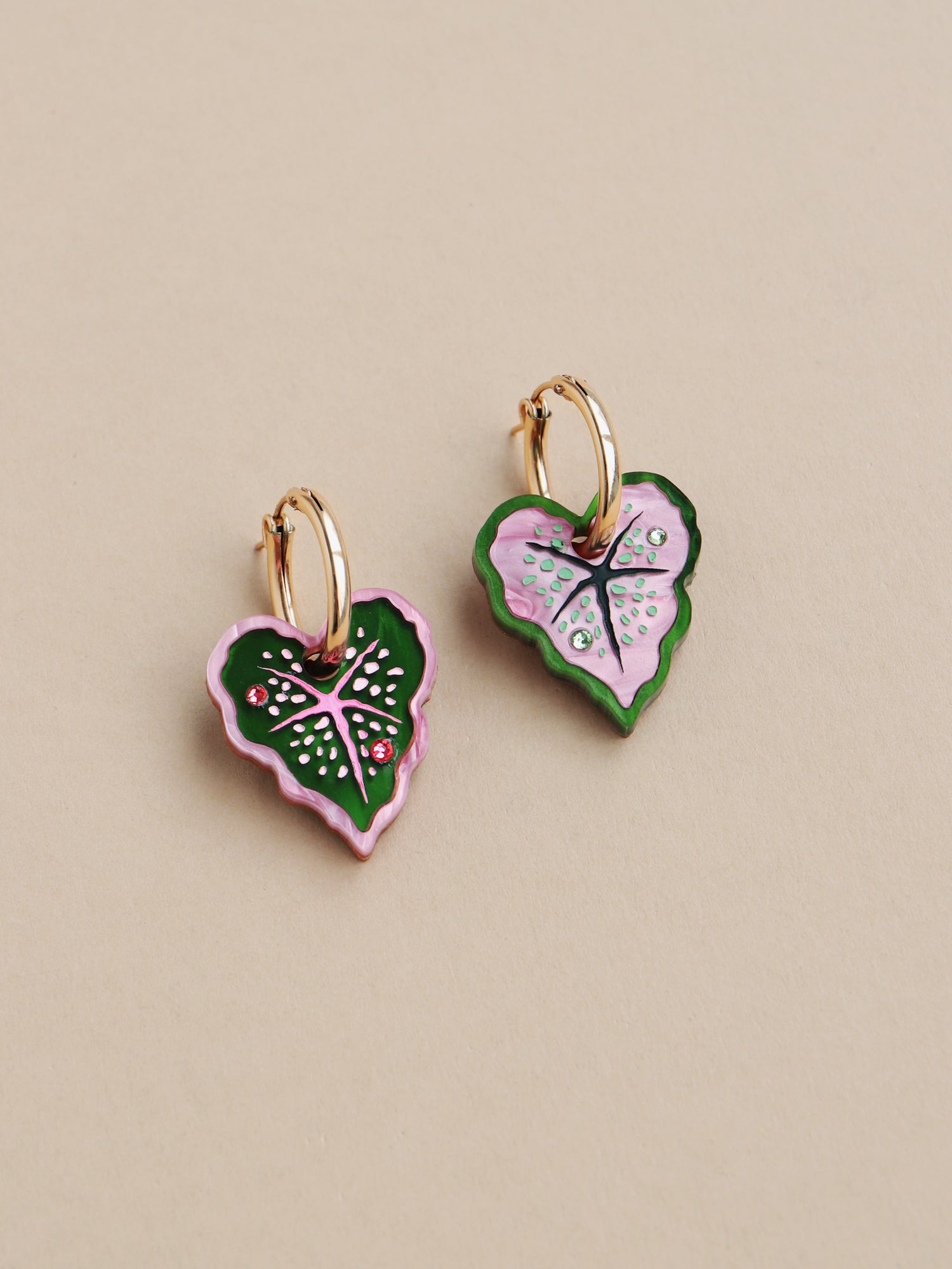 Heart-shaped caladium leaf hoop earrings. A design collaboration with L.O.M, a colourful party-wear brand. Handmade in the UK by Wolf & Moon.