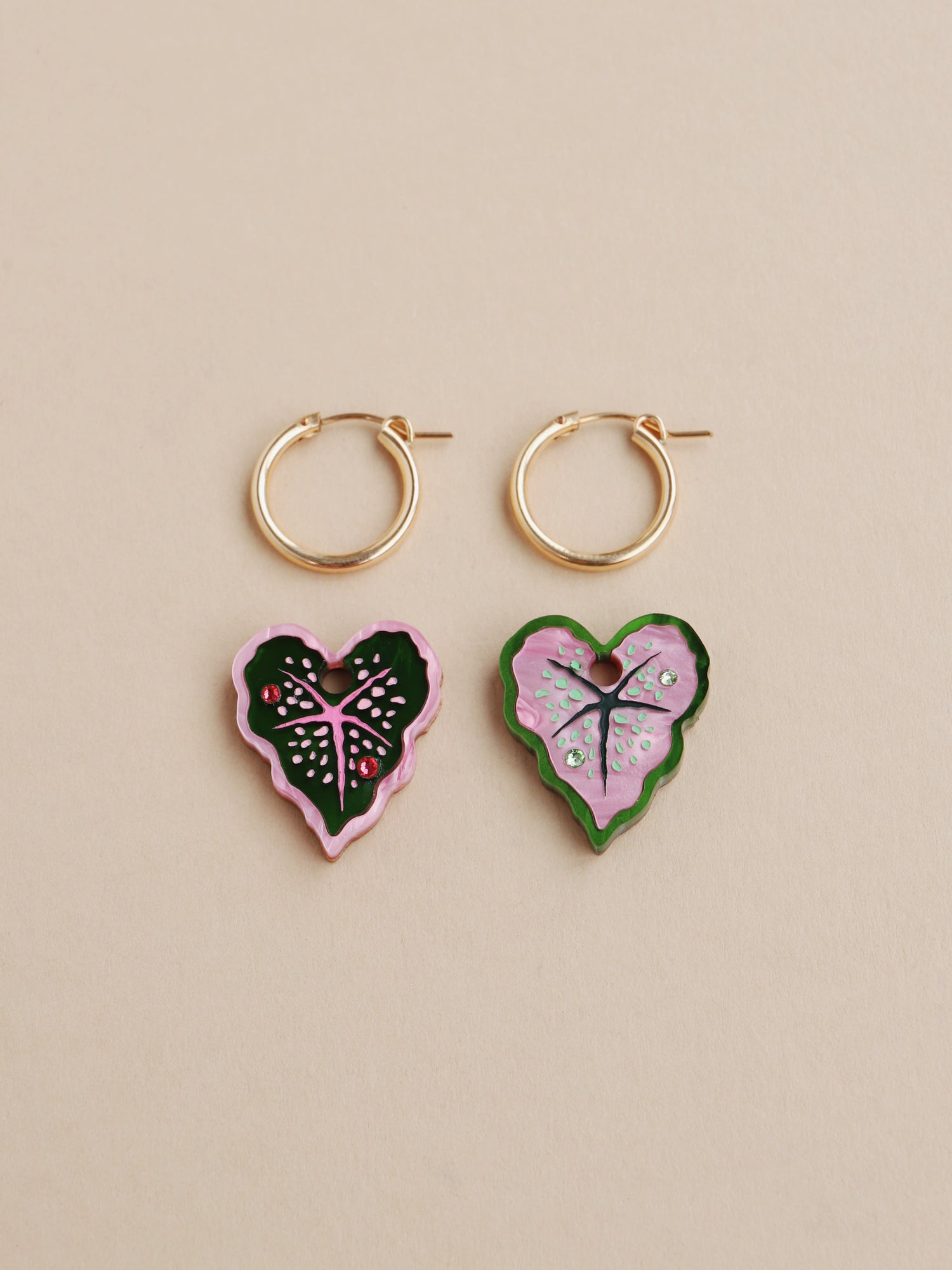 Heart-shaped caladium leaf hoop earrings. A design collaboration with L.O.M, a colourful party-wear brand. Handmade in the UK by Wolf & Moon.