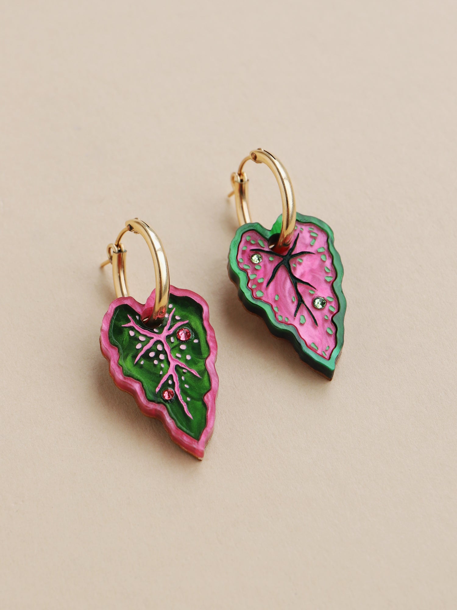 Heart-shaped caladium leaf hoop earrings. A design collaboration with L.O.M, a colourful party-wear brand. Handmade in the UK by Wolf & Moon.