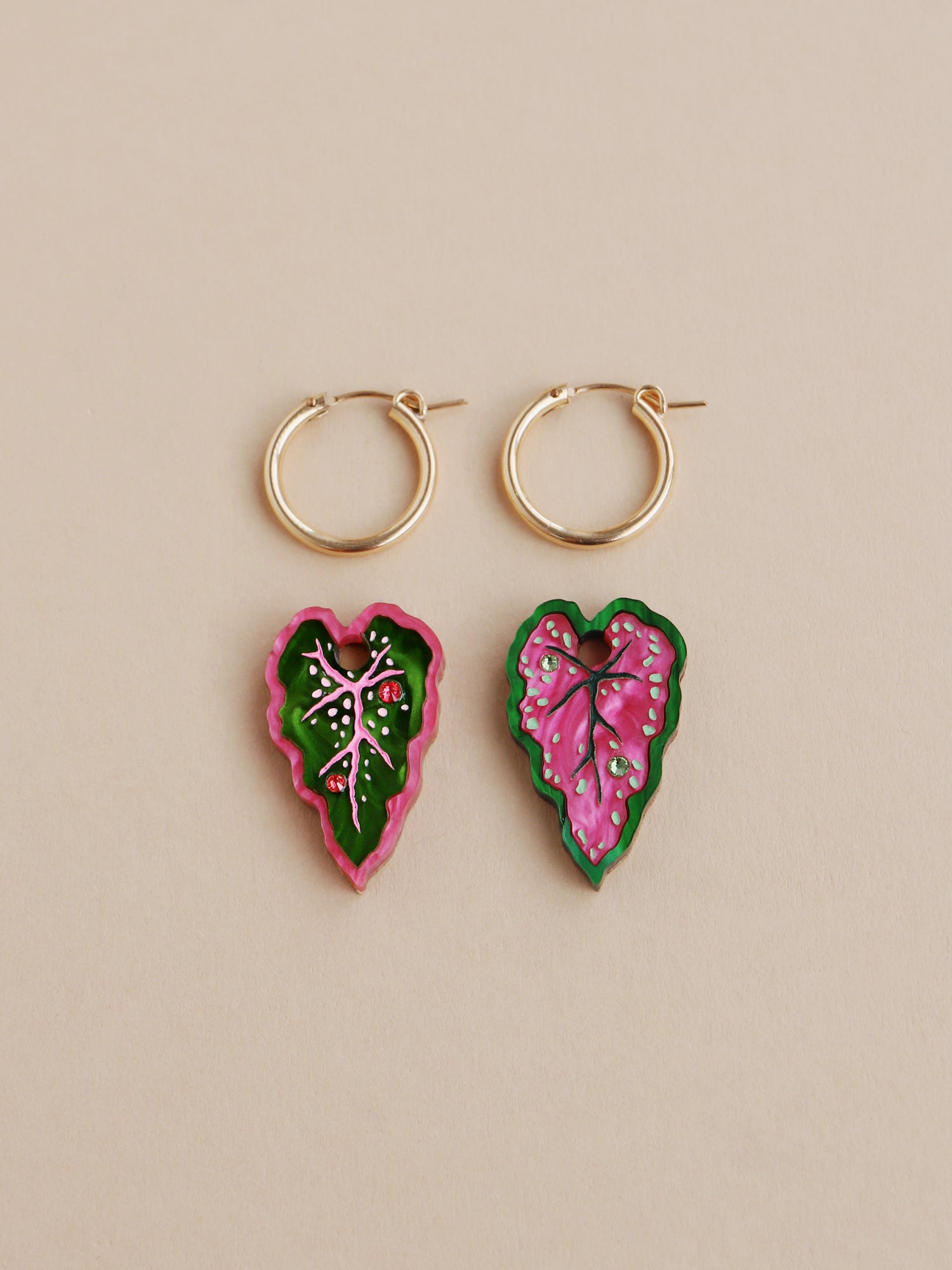 Heart-shaped caladium leaf hoop earrings. A design collaboration with L.O.M, a colourful party-wear brand. Handmade in the UK by Wolf & Moon.