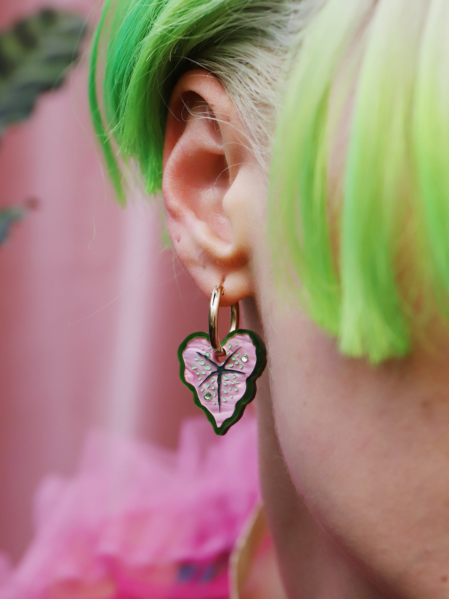 Heart-shaped caladium leaf hoop earrings. A design collaboration with L.O.M, a colourful party-wear brand. Handmade in the UK by Wolf & Moon.