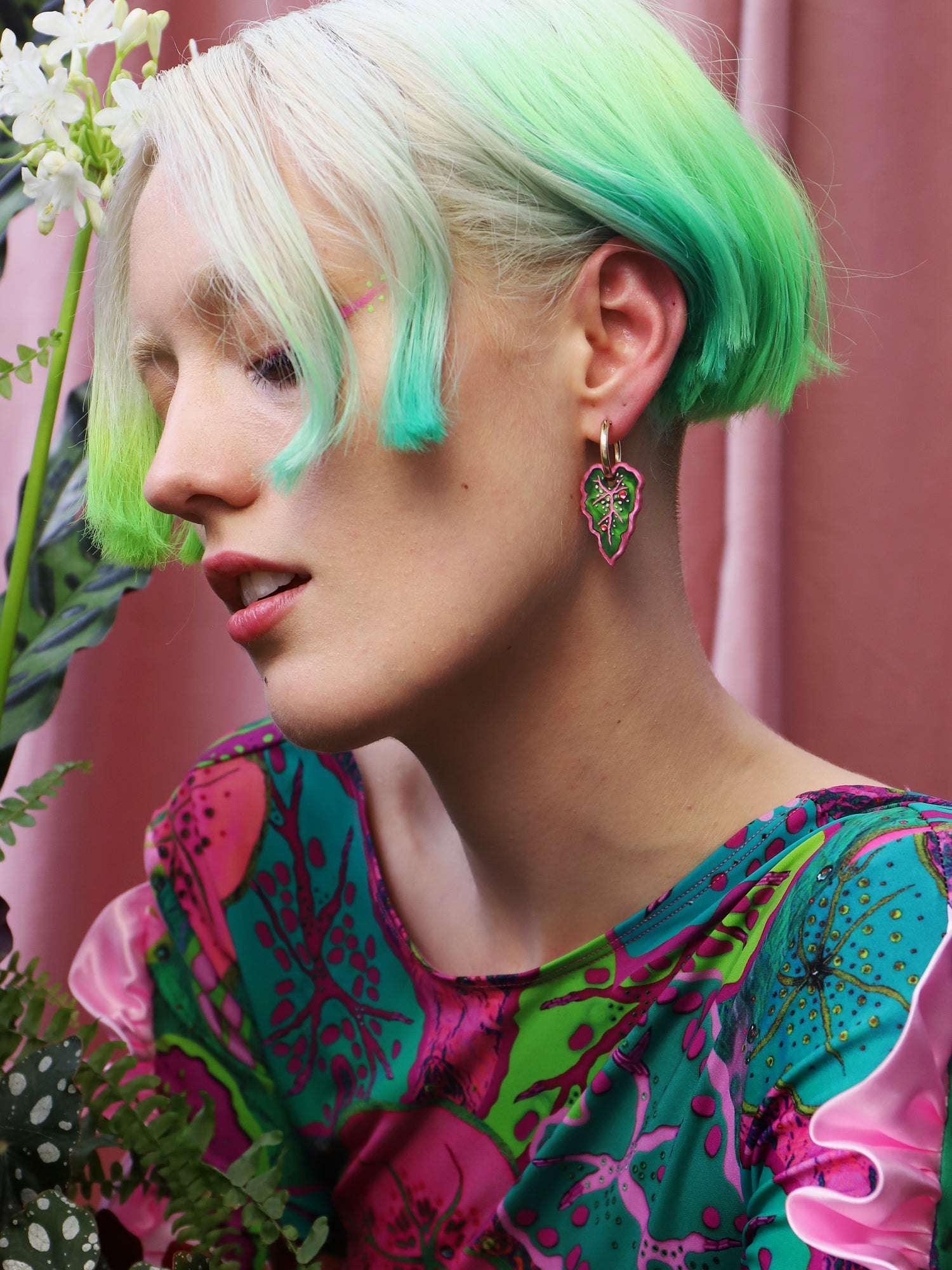 Heart-shaped caladium leaf hoop earrings. A design collaboration with L.O.M, a colourful party-wear brand. Handmade in the UK by Wolf & Moon.