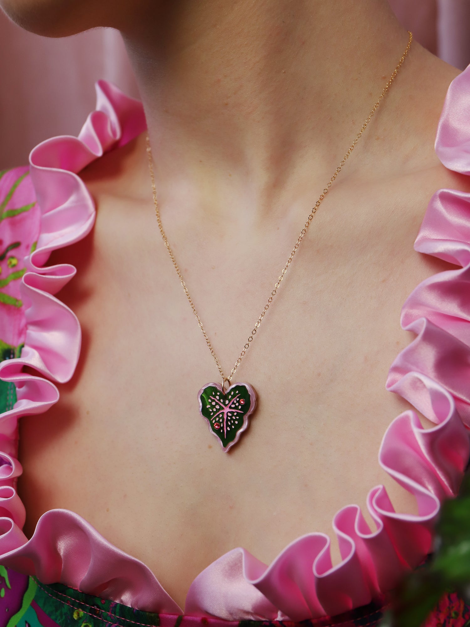 Heart-shaped caladium leaf necklace. A design collaboration with L.O.M, a colourful party-wear brand. Handmade in the UK by Wolf & Moon.