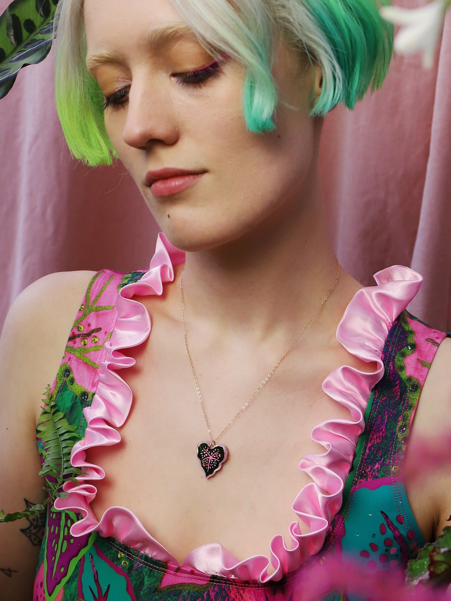 Heart-shaped caladium leaf necklace. A design collaboration with L.O.M, a colourful party-wear brand. Handmade in the UK by Wolf & Moon.