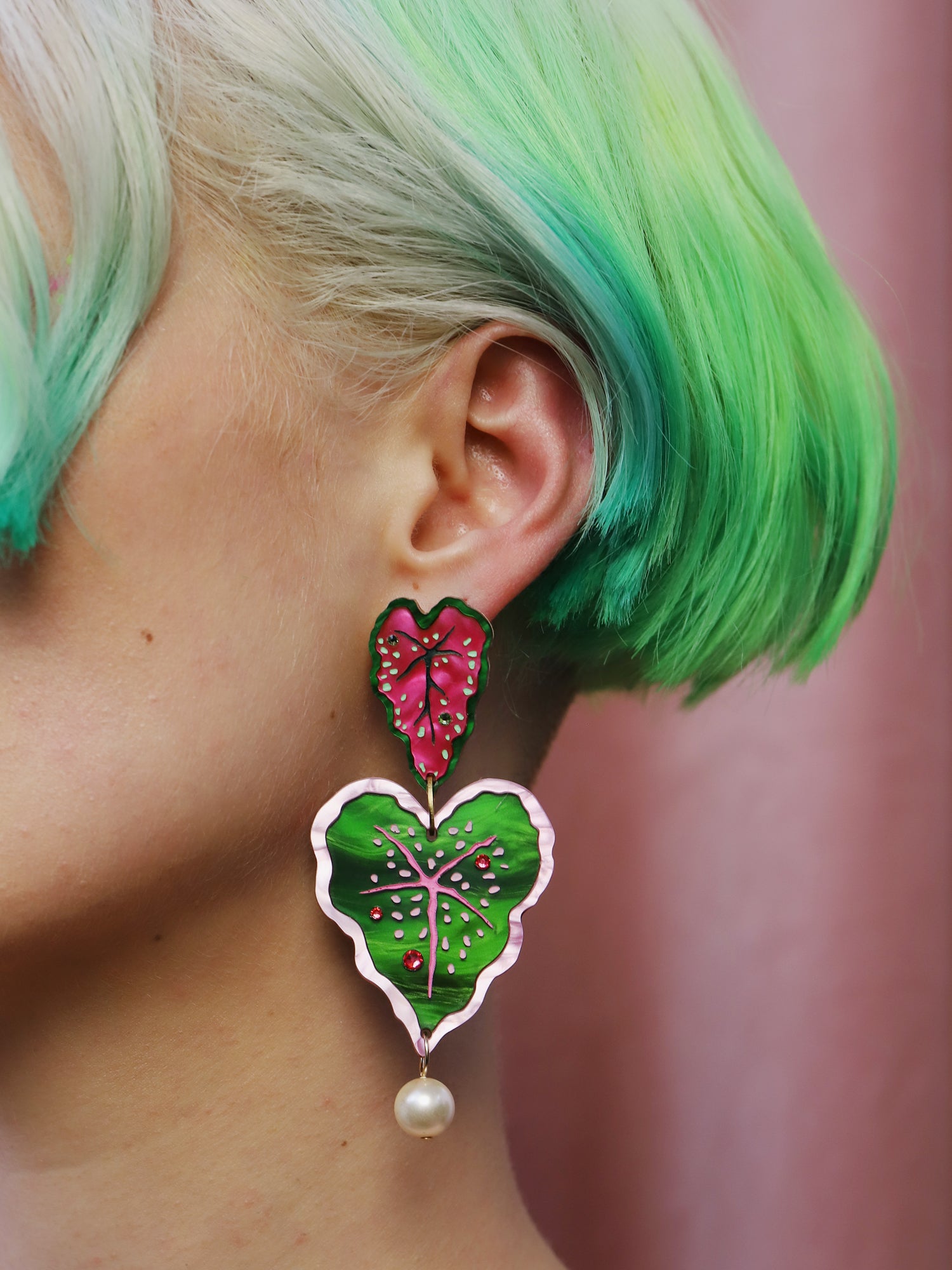  Heart-shaped caladium leaf statement earrings. A design collaboration with L.O.M, a colourful party-wear brand. Handmade in the UK by Wolf & Moon.