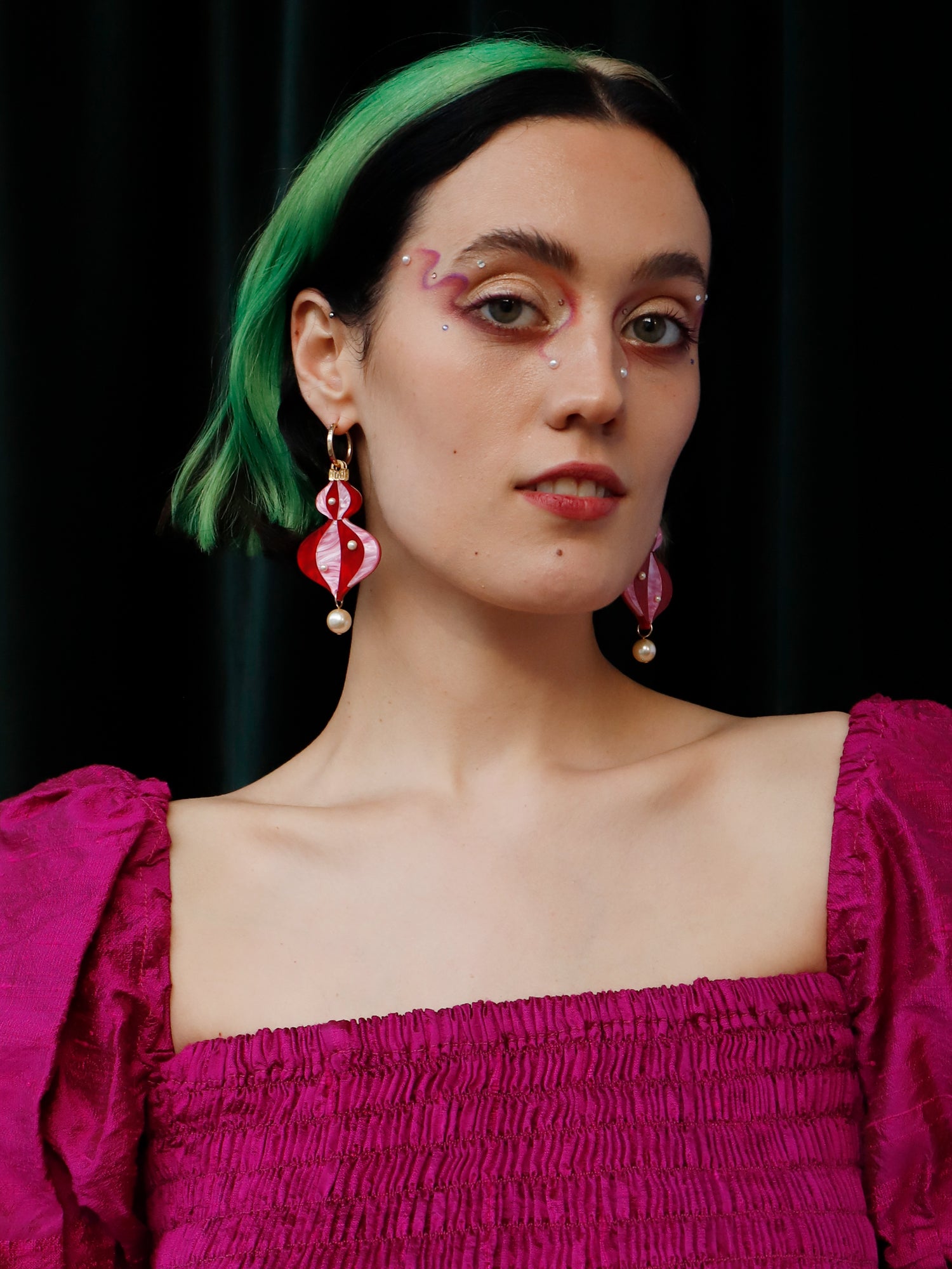 Vintage-inspired bauble statement hoops made from red and pink marbled acrylic with gold mirror details. Wear with our gold-filled hoops. Handmade in London by Wolf & Moon.