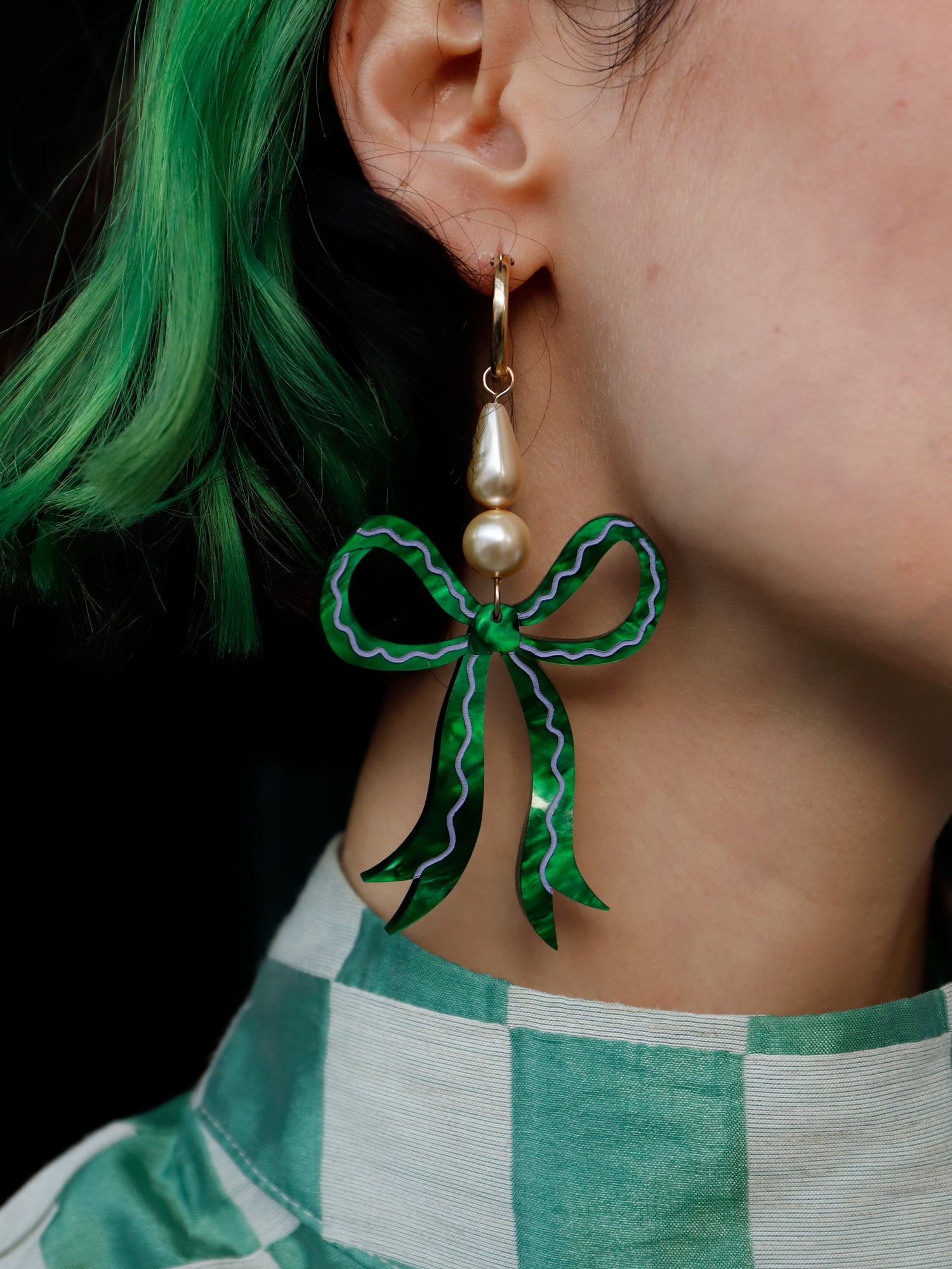 Statement bow earrings made from emerald marbled acrylic with hand-inked details. Finished off with high quality glass pearls and 14k gold-filled findings. Each bow is hand-sculpted into a 3D form giving it a lovely realistic ribbon-like effect. Handmade in London by Wolf & Moon.